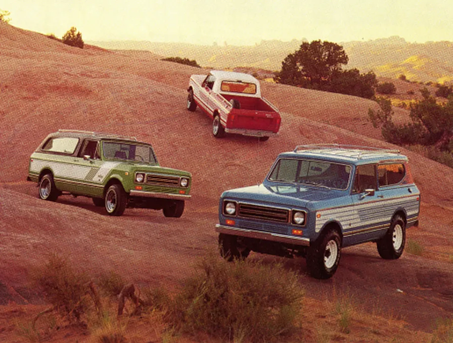 A family with their pickup truck in the mountains